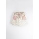 Skirt with pink textured pocket